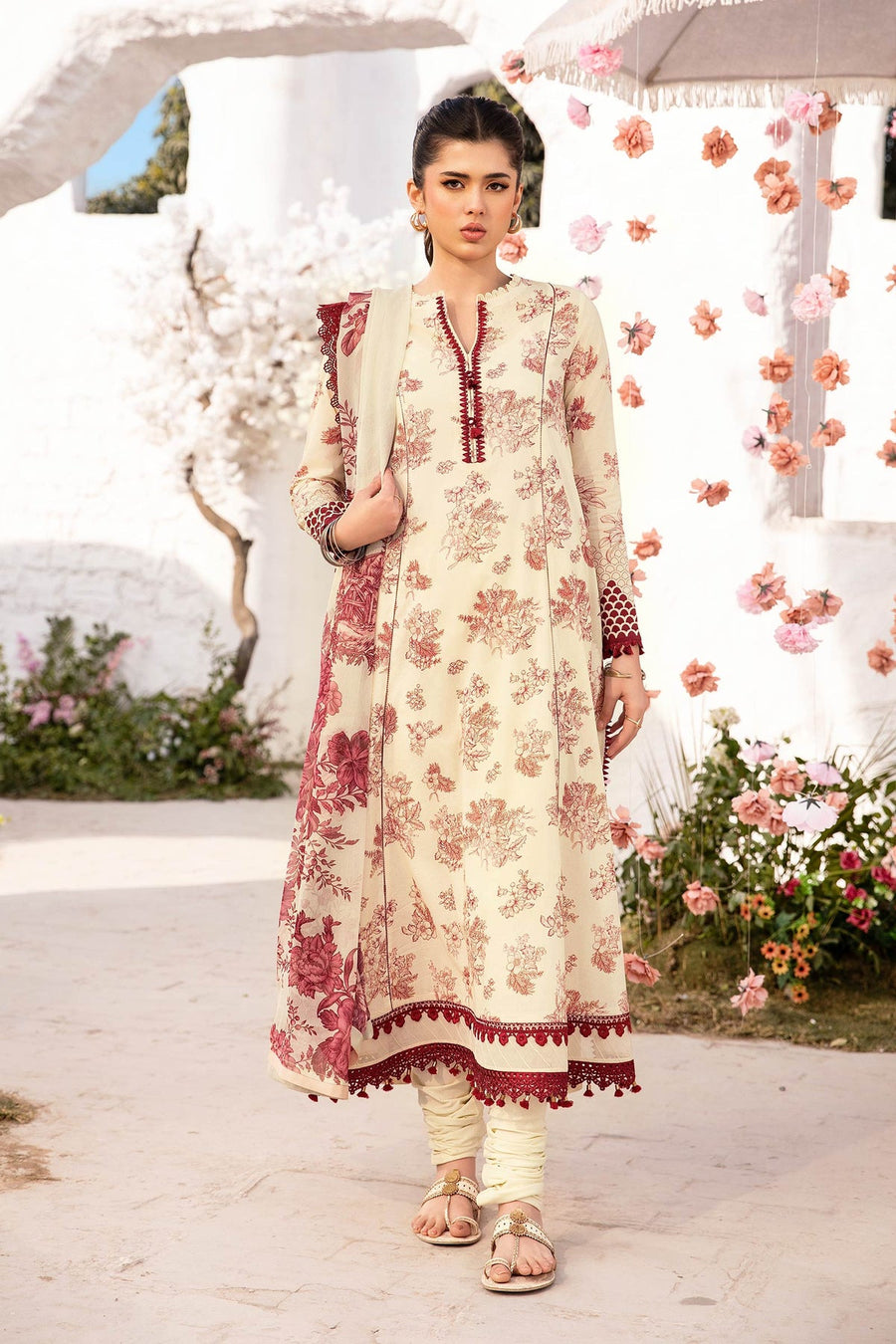 A light yellow colored unstitched 3-piece suit by Maria.B, consisting of a shirt, trousers, and a dupatta with embroidered details.