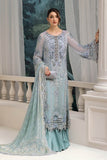 Woman in a light blue embroidered traditional outfit by Maria b Luxury Chiffon 2025