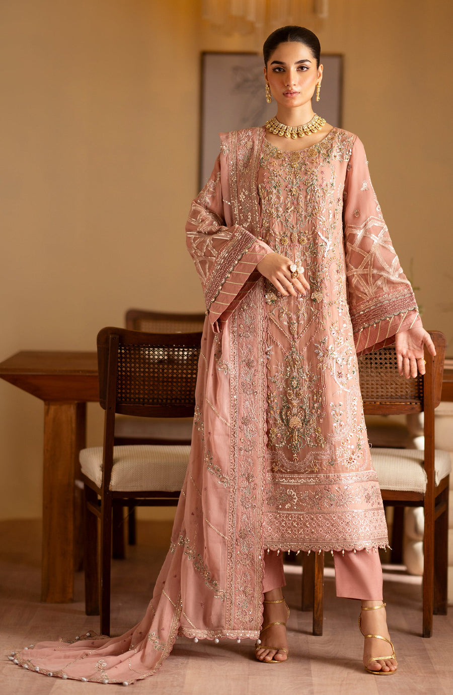 traditional pink dress with embroidered details