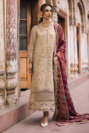 Woman in traditional attire standing in an architectural setting