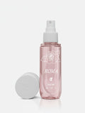 Pink spray bottle with white cap and 'ROMA' branding on a light gray background